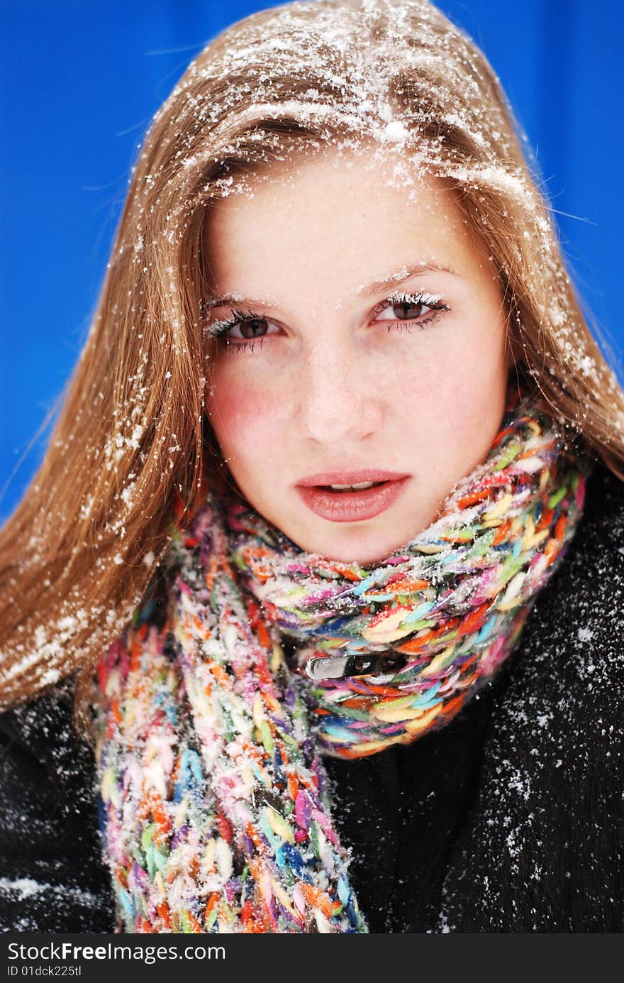 Beautiful young woman with snow on her hair. Beautiful young woman with snow on her hair