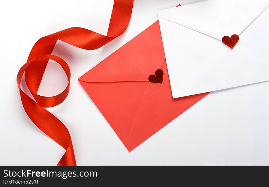 Red and white envelope and red bow. Red and white envelope and red bow