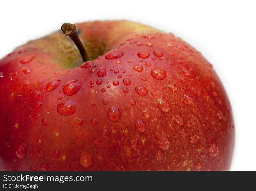 Apple with drops on a white background. Apple with drops on a white background