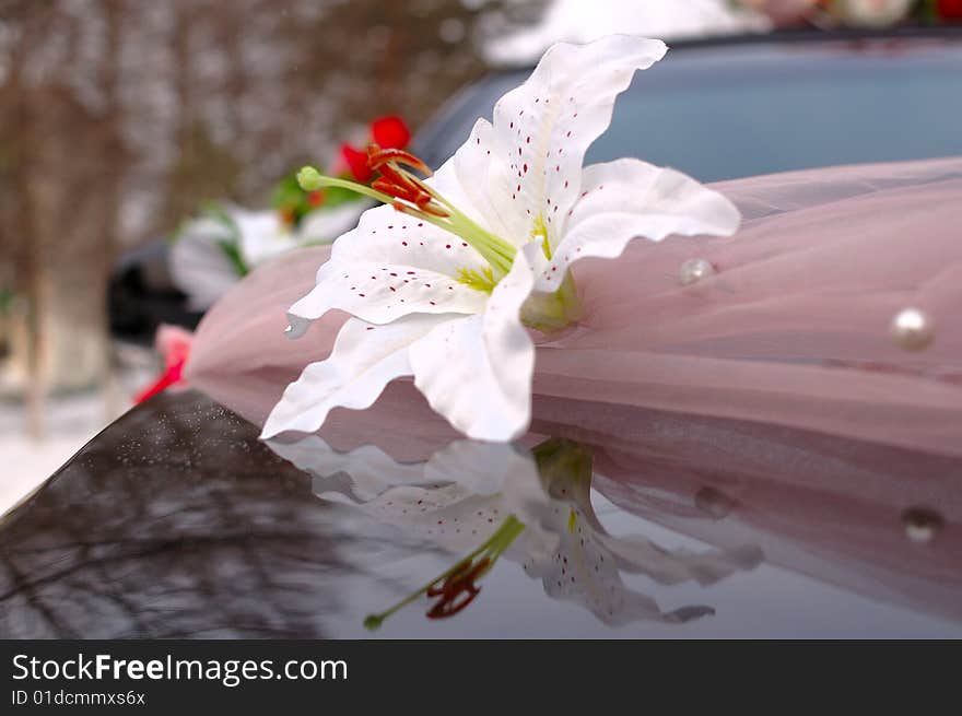 Wedding decoration on black limousine car.