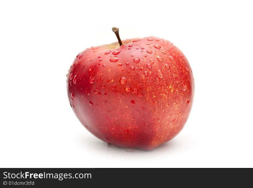 Apple with drops on a white background. Apple with drops on a white background