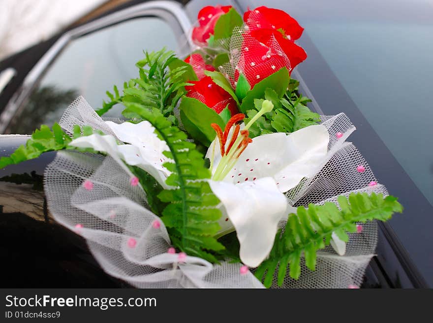 Wedding decoration (flowers) on black limousine car. Wedding decoration (flowers) on black limousine car.