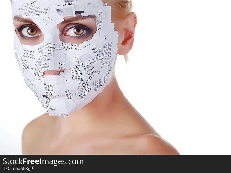 Face of a young woman in paper mask