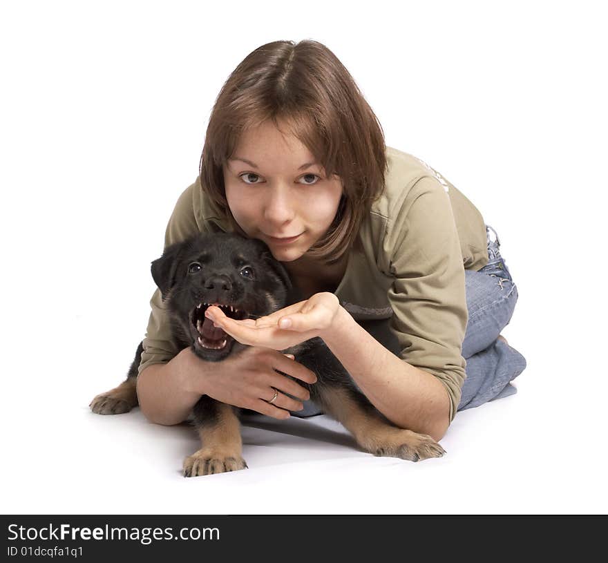 The girl holds the puppy in hands