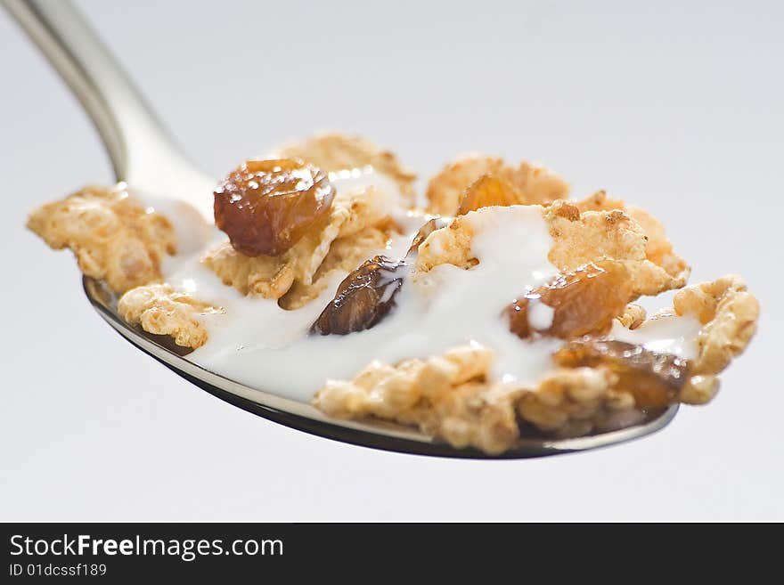 Bowl of cereal with raisins and milk