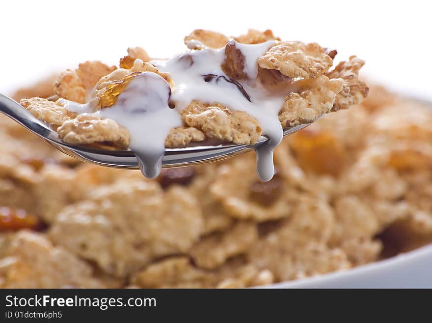 Bowl of cereal with raisins and milk