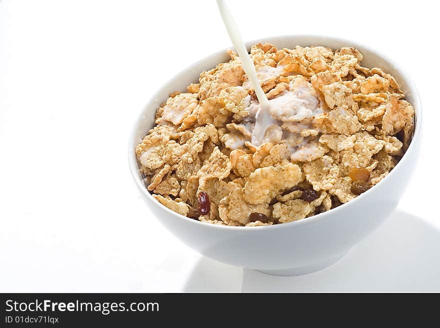 Bowl of cereal with raisins and milk