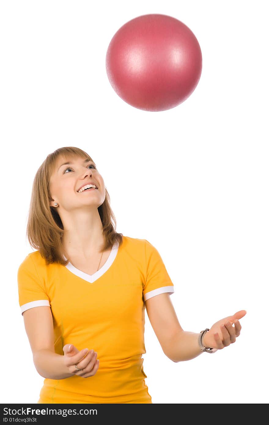 A girl throwing a red ball up. A girl throwing a red ball up