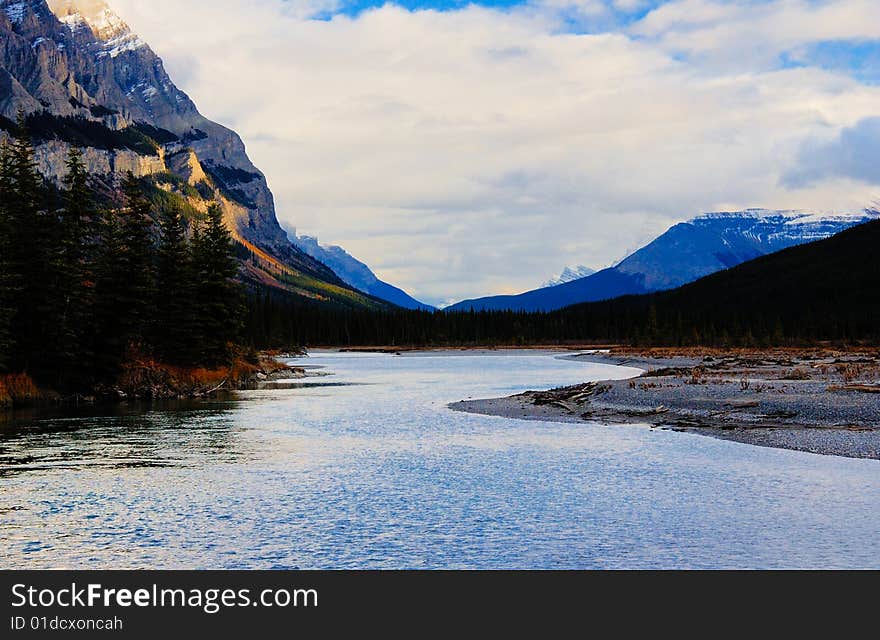 Glacier lake in the mountain in the early fall