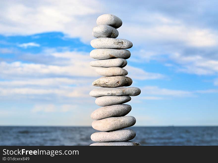 Pile of grey stones in the evening on a beach in Estonia. Pile of grey stones in the evening on a beach in Estonia