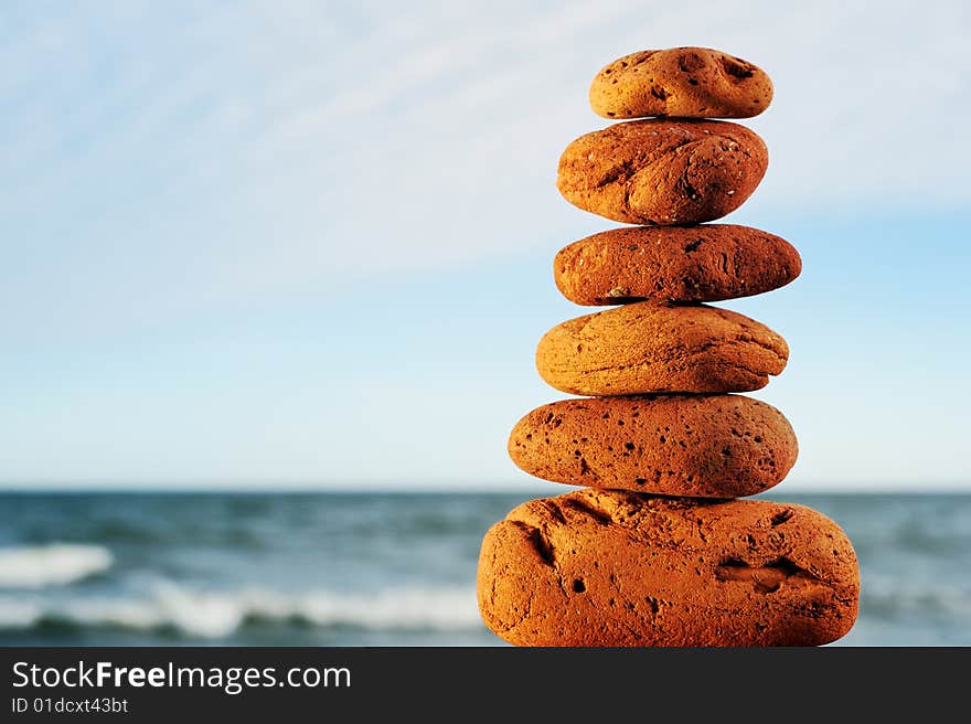 Red Stone Tower On A Beach