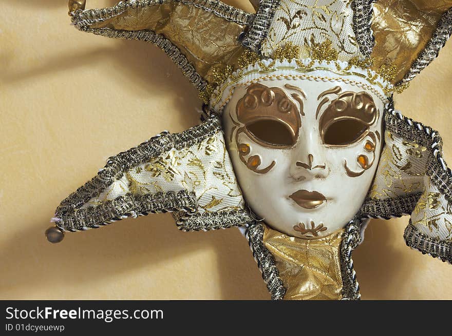 Beautiful Venetian Mask on Light Yellow Wall