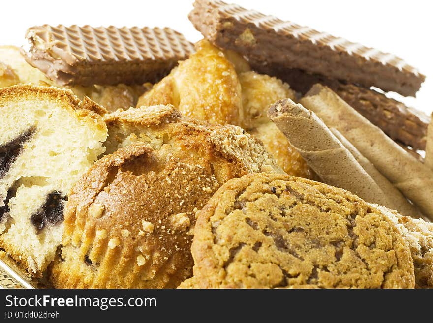 A lot of dessert one over another on white background. A lot of dessert one over another on white background