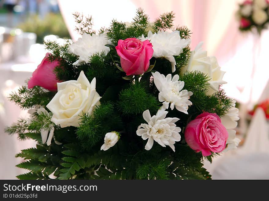 Wedding bouquet with roses on the table