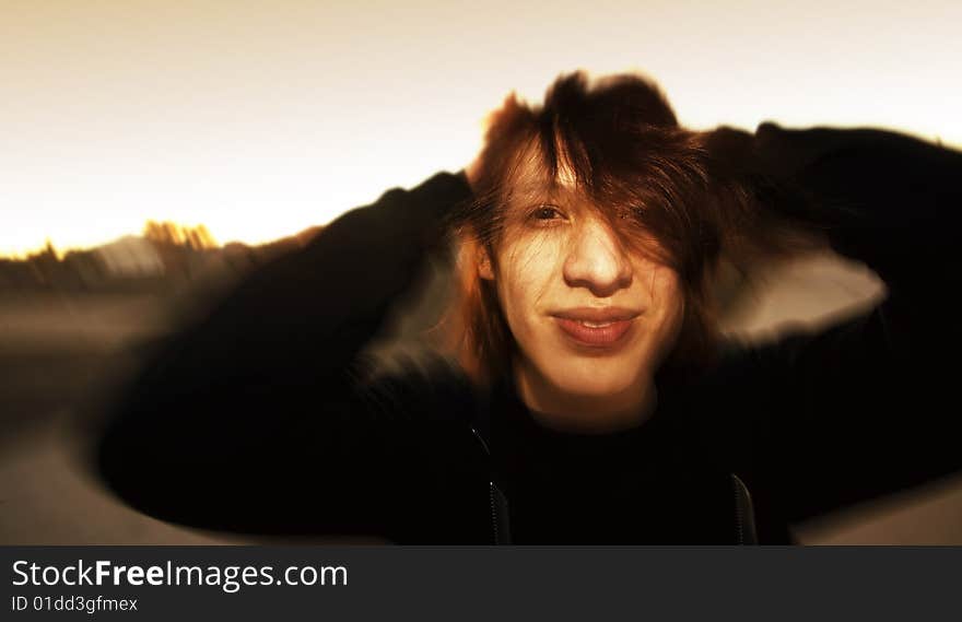 Motion effect shot of Hispanic young man in afternoon light