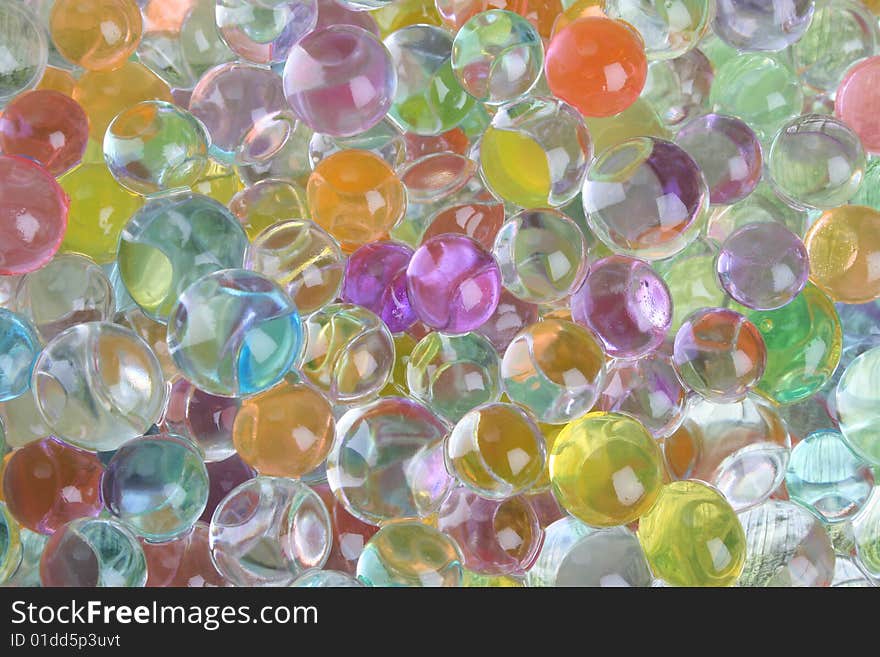 A variety of colored gelatine balls as a background. A variety of colored gelatine balls as a background