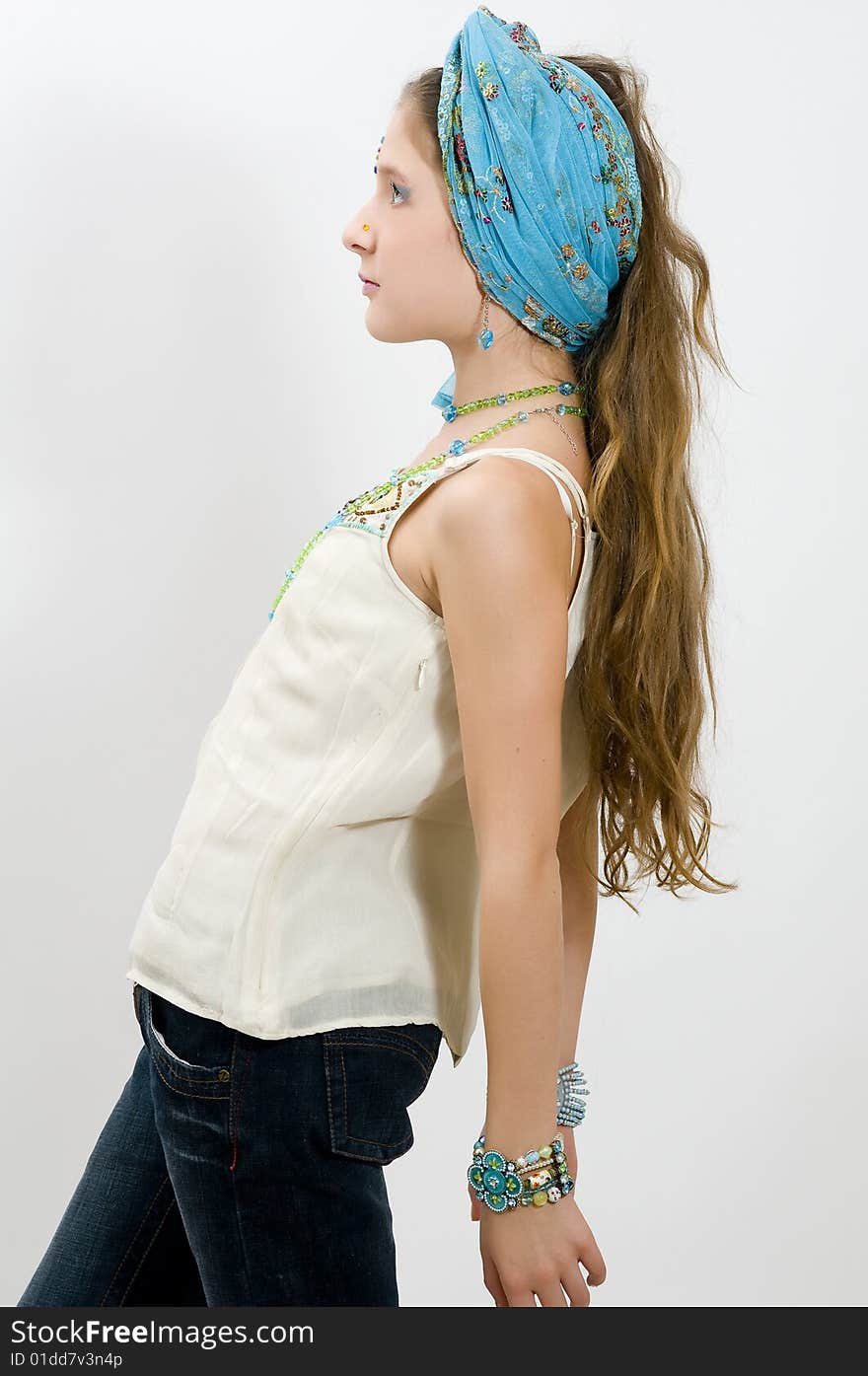 Fashion girl posing with blue scarf in hair