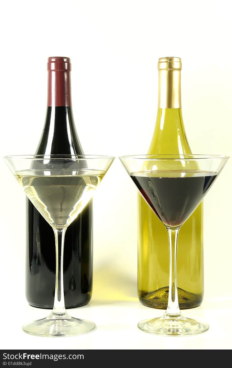 Wine glasses and bottles of opposite color. Wine glasses and bottles of opposite color