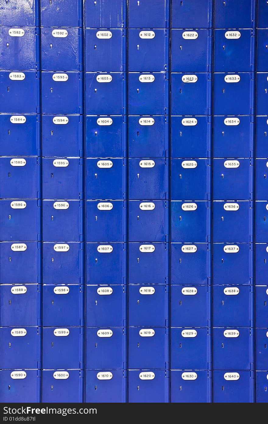 Wall of blue Post Office boxes - portrait interior