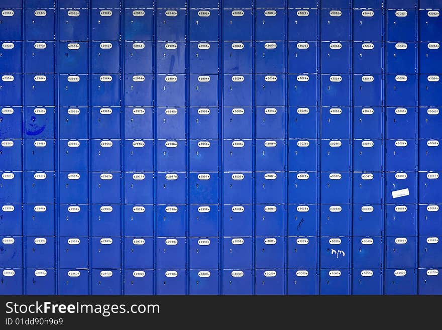 Long wall of blue Post Office boxes - landscape interior