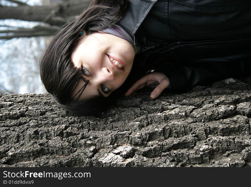 Young Girl At An Old Tree