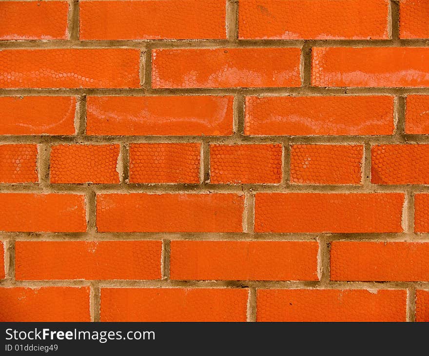 Relief on a brick surface in a wall laying