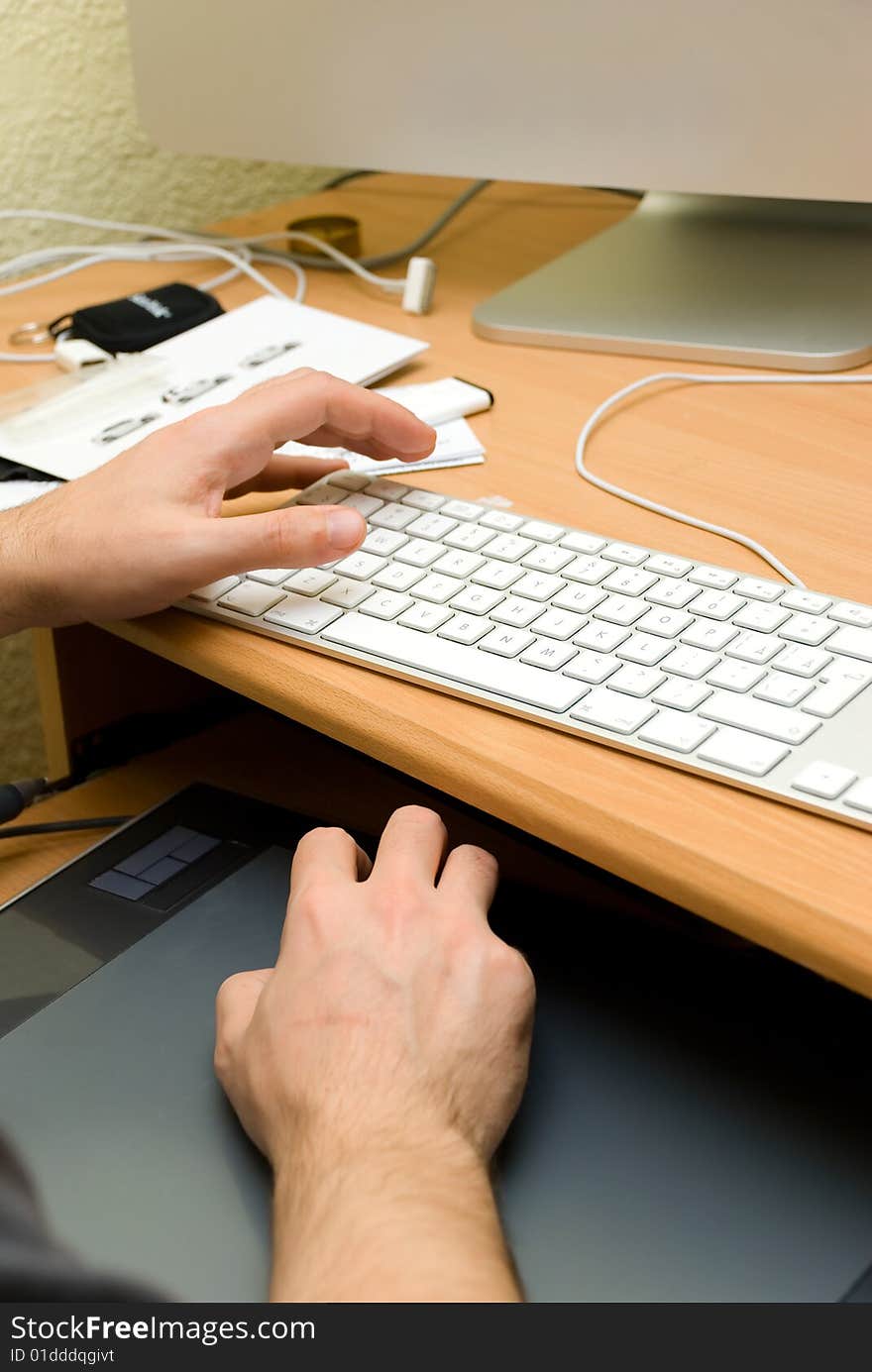 Hands of a man working at the computer. Hands of a man working at the computer