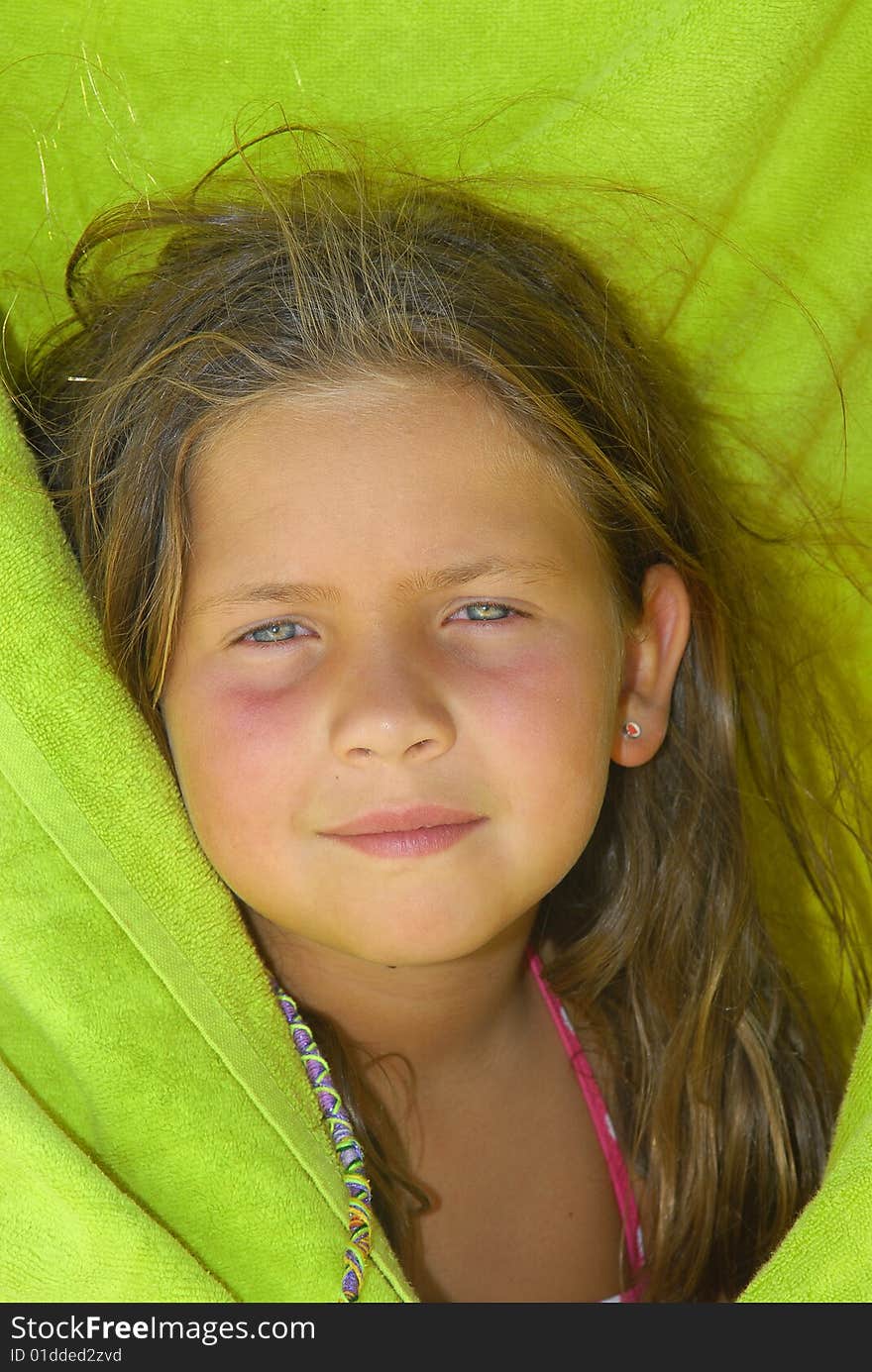 Girl with green towel posing