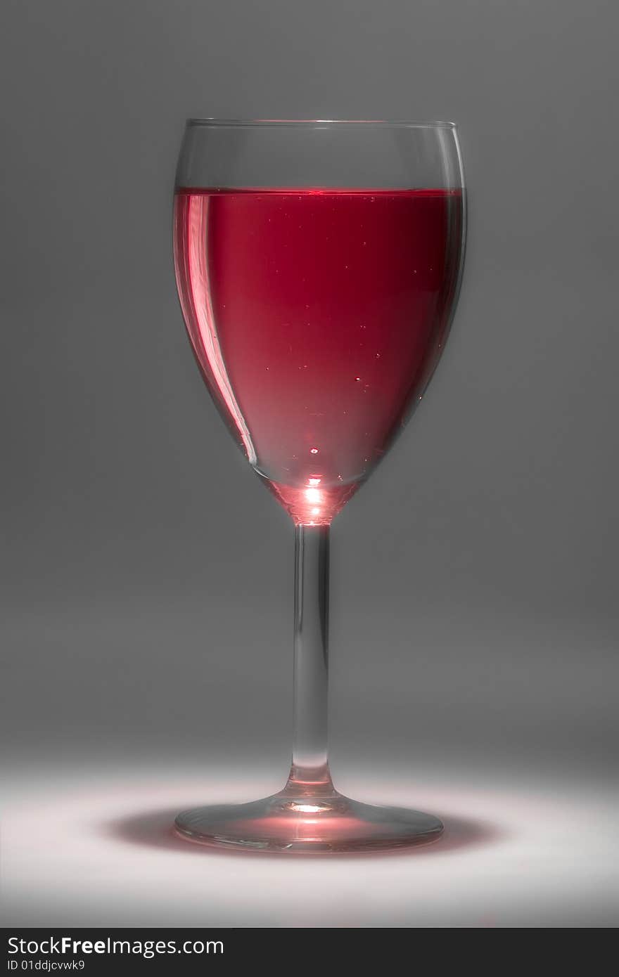 Glass with beautiful sparkling rose wine. Glass with beautiful sparkling rose wine