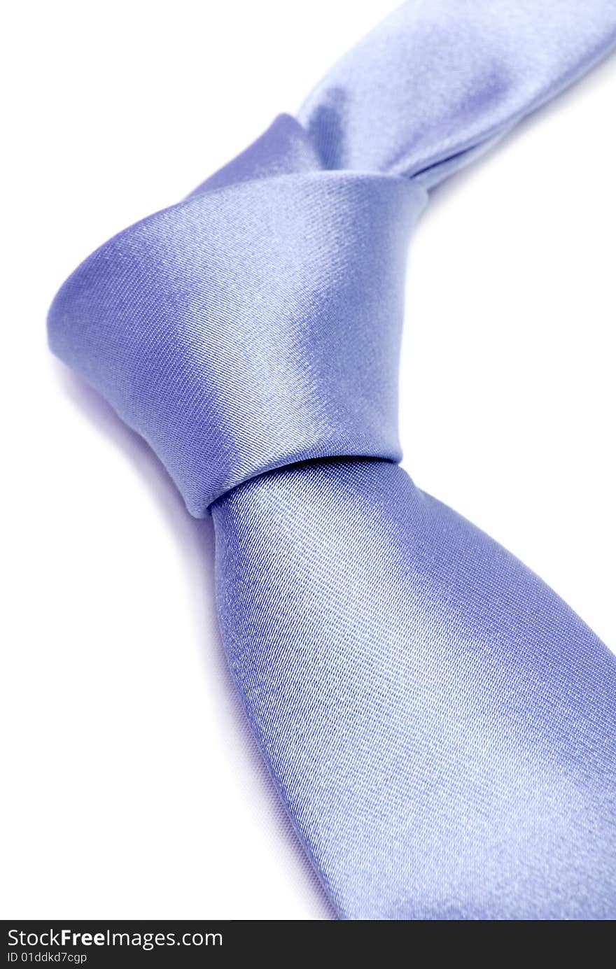 Blue tie is fastend in knot