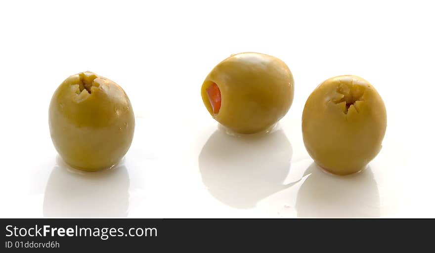 Green olives on white background. Green olives on white background