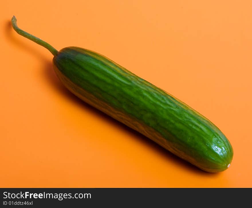 Cucumber on orange background