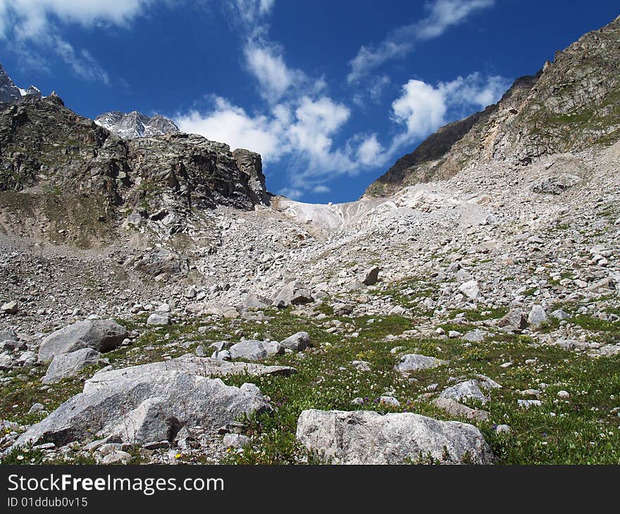 Pass in the mountains. Blue sky.