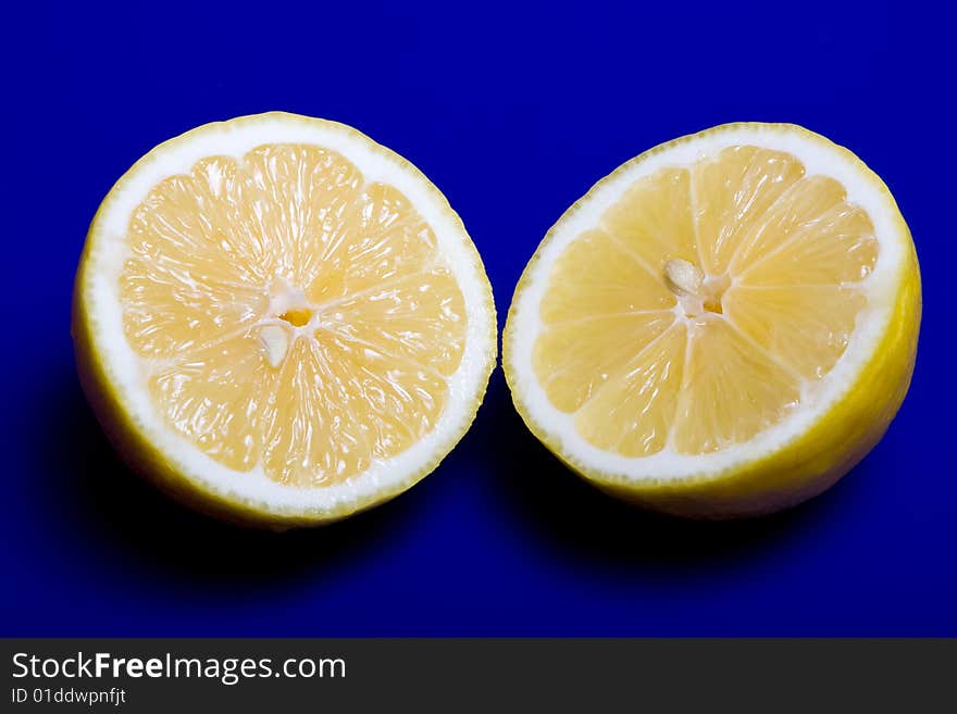 Cuted lemon on blue background