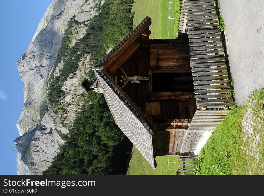 A small chapel im an alpine village. A small chapel im an alpine village.