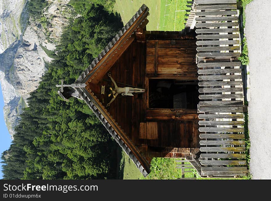 A small chapel in an alpine village. A small chapel in an alpine village.