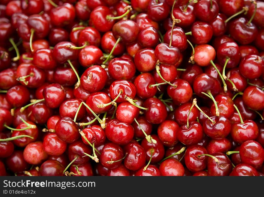 Cluster of Fresh Cherries at a Farmers Market