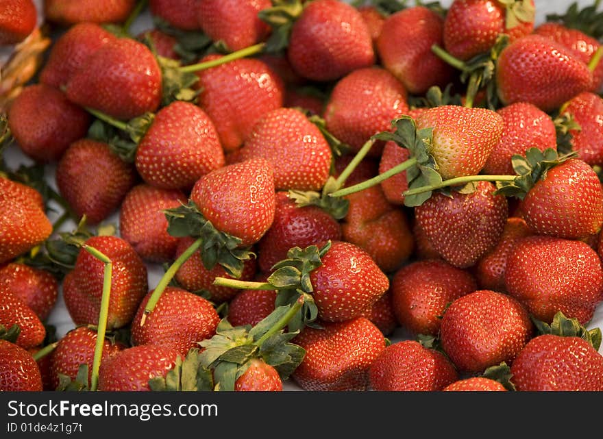 Cluster of Fresh Strawberries at a Farmers Market