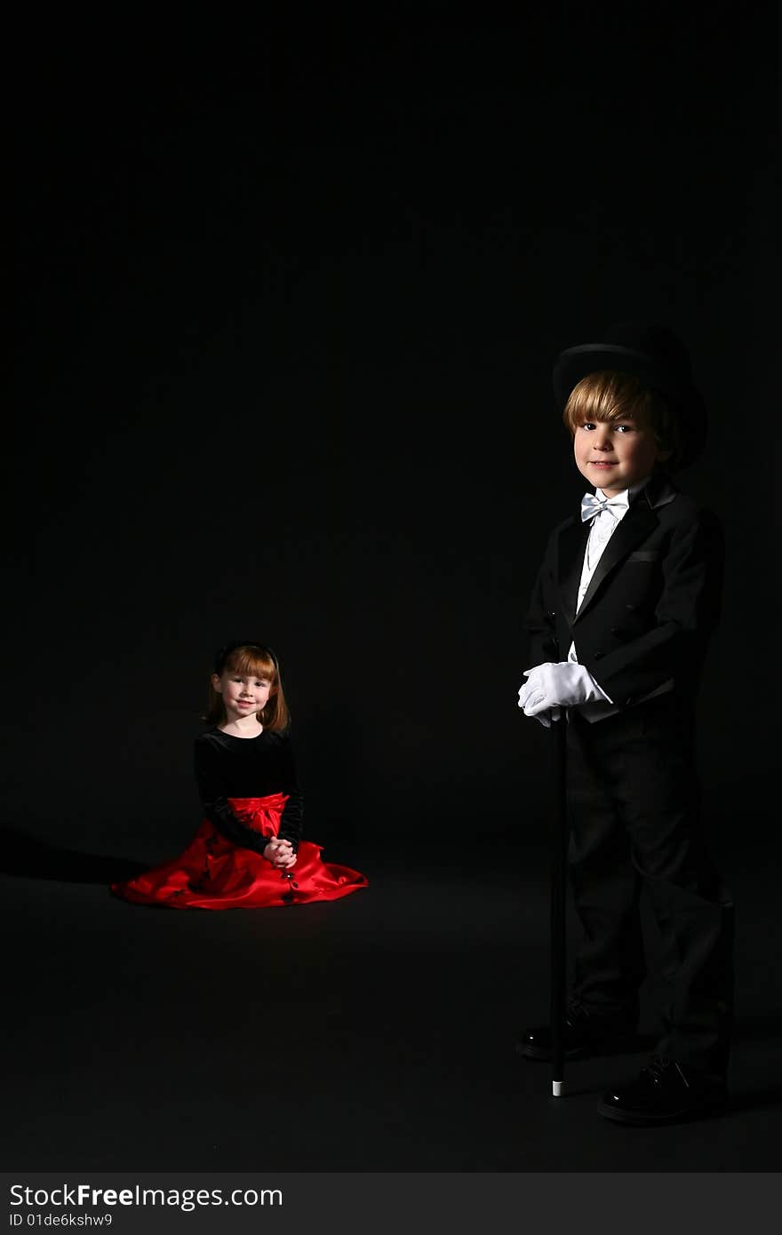 Children in formal clothing; boy in foreground