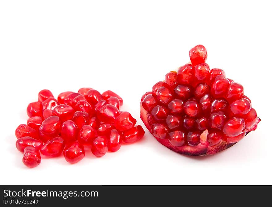 Piece of pomegranate over white background