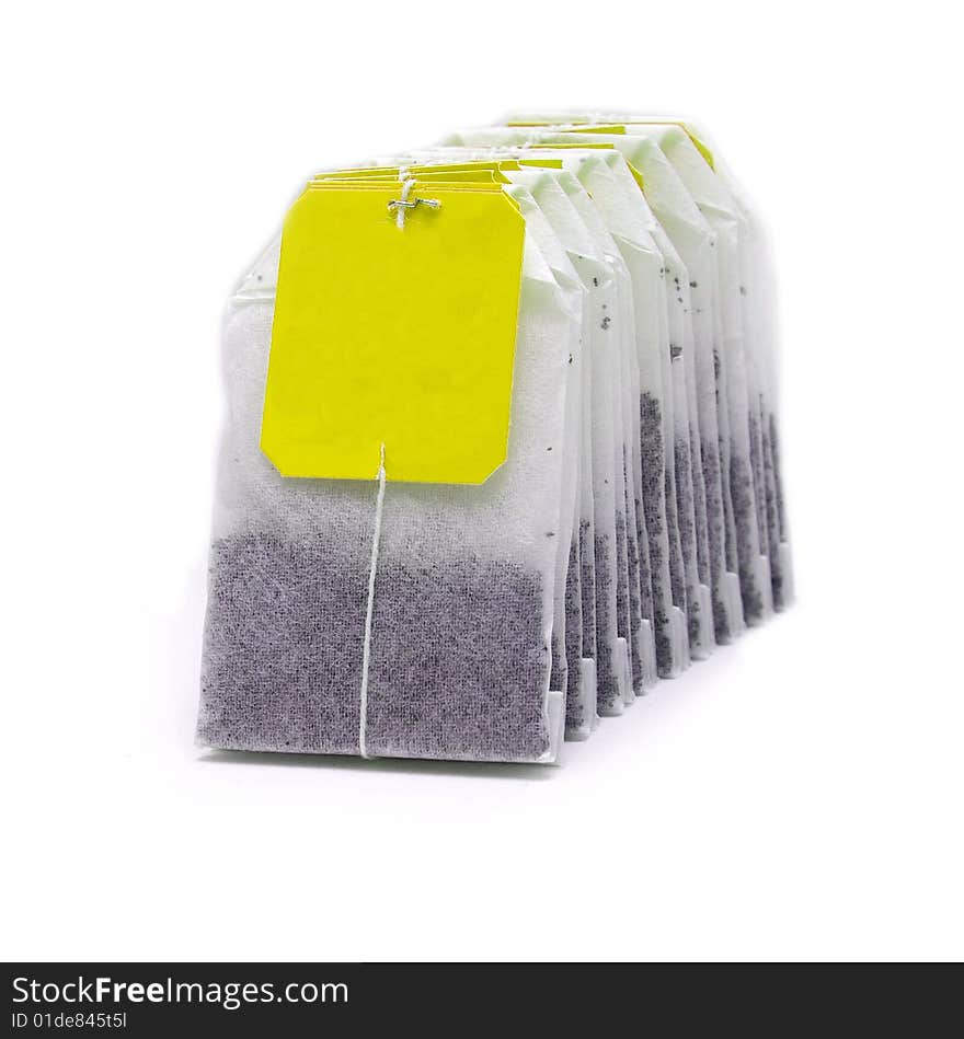 Tea bags, yellow label, isolated image, white background