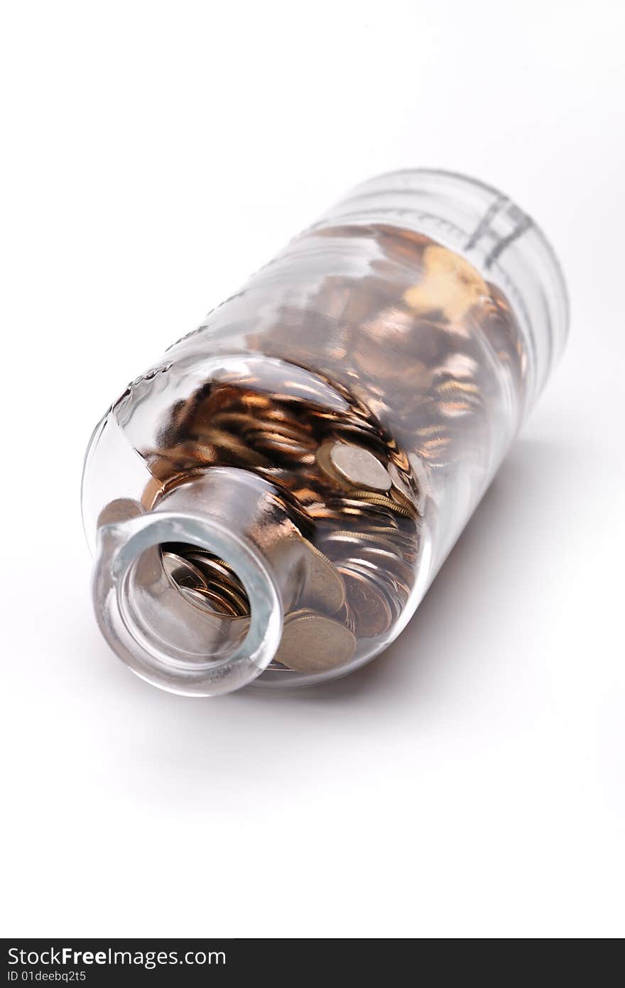 Glass bottle full of coins