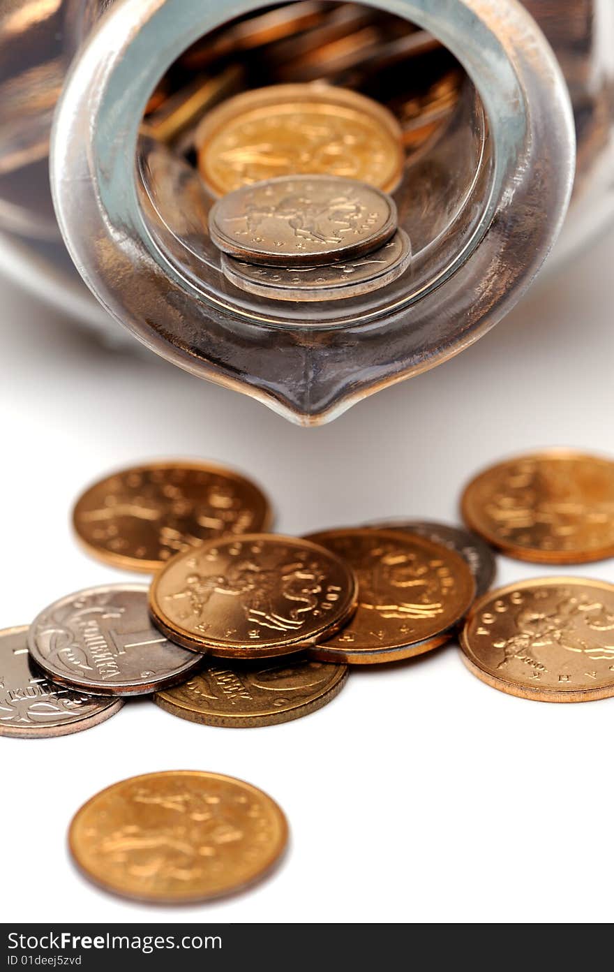 Glass bottle full of coins