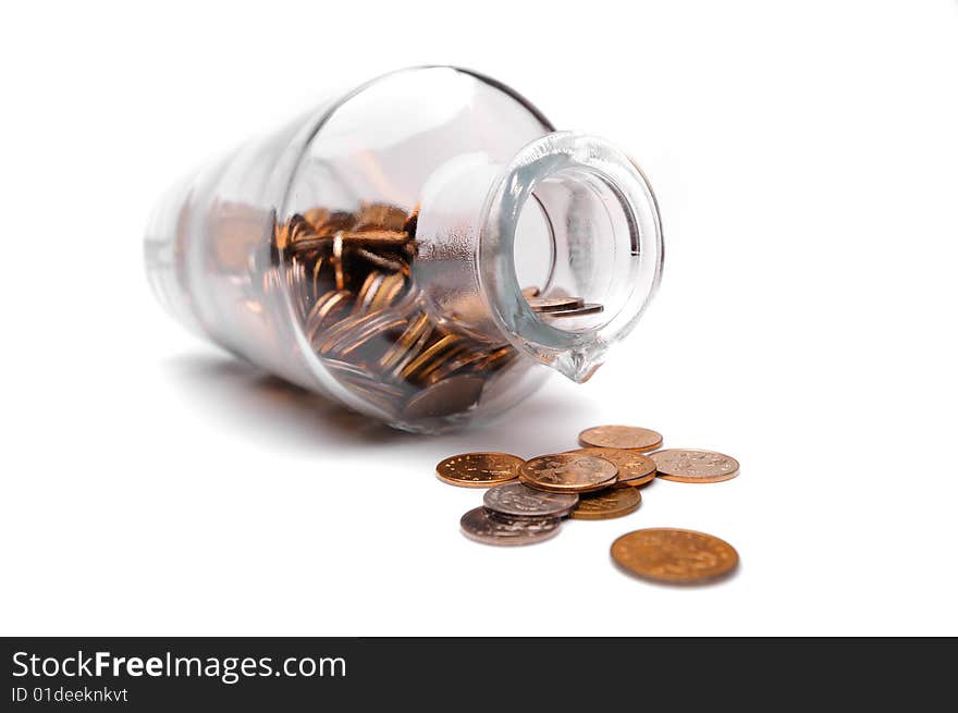 Glass bottle full of coins