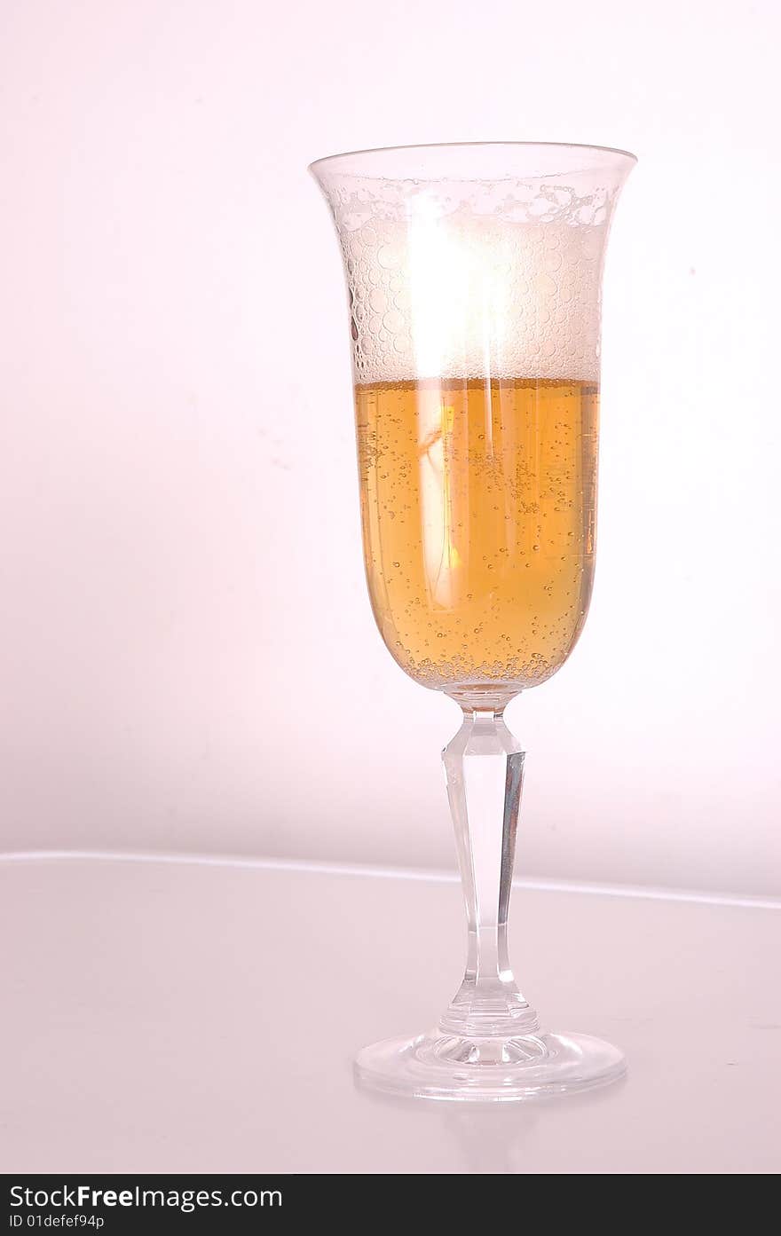 Glass of beer on a white background