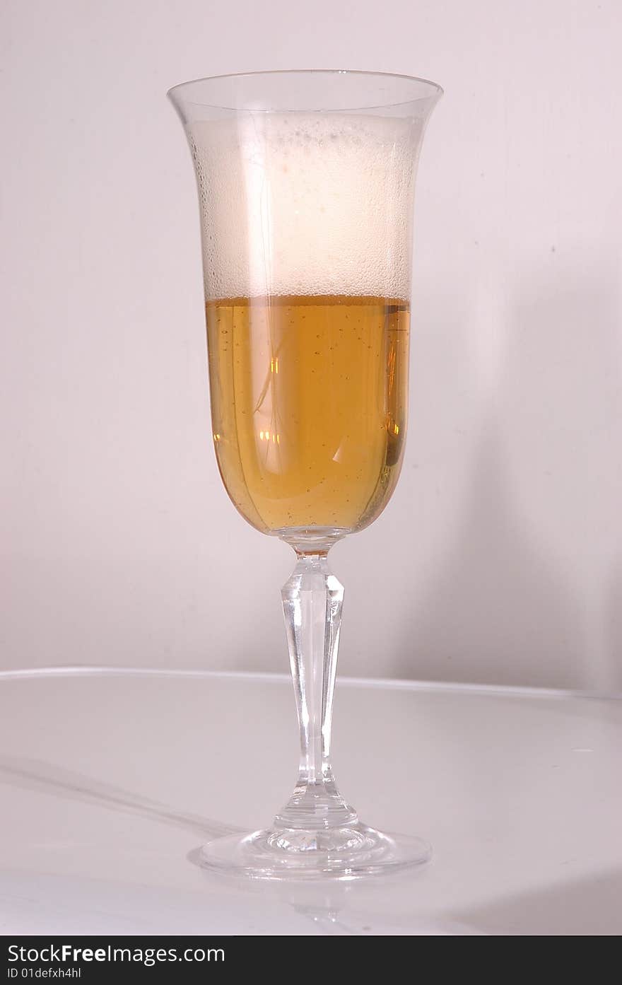 Glass of beer on a white background