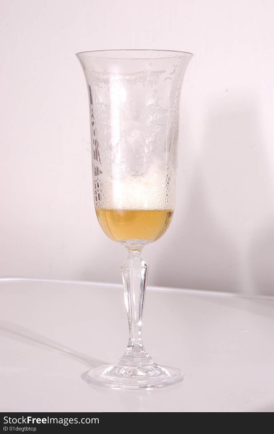 Glass of beer on a white background