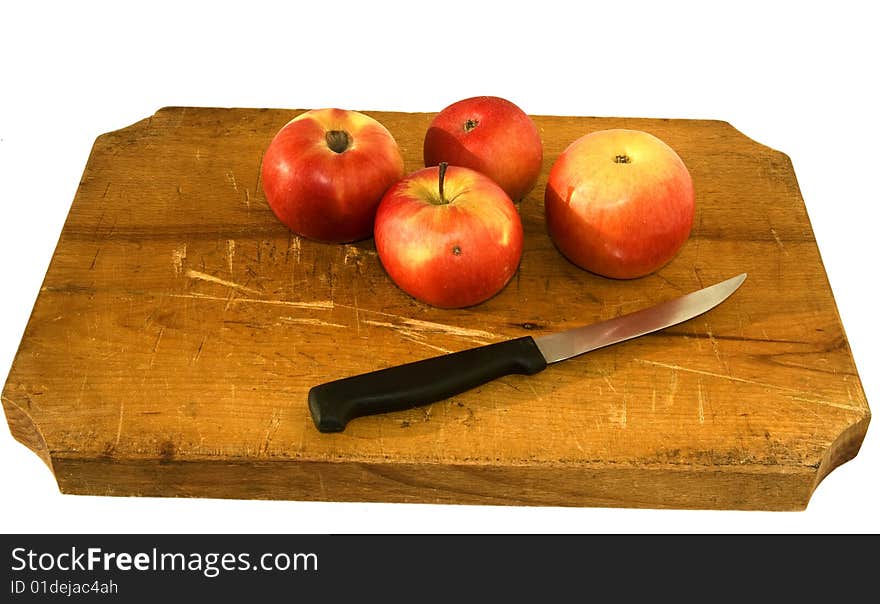 Desk with apples and knife