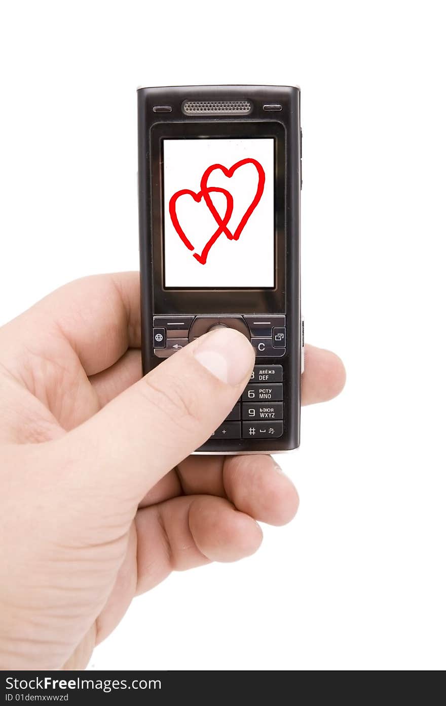 Mobile phone in man hand whith two hearts on display