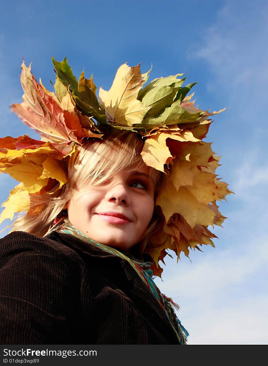 Autumn girl with yellow leaves and blue sky. Autumn girl with yellow leaves and blue sky